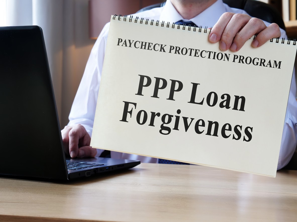 Accountant shows form for PPP loan forgiveness.