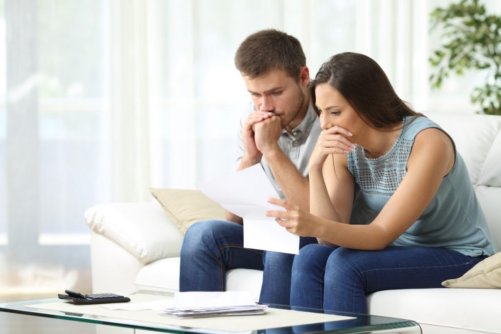 Pensive Spouses Managing Family Budget During A Financial Hardship.