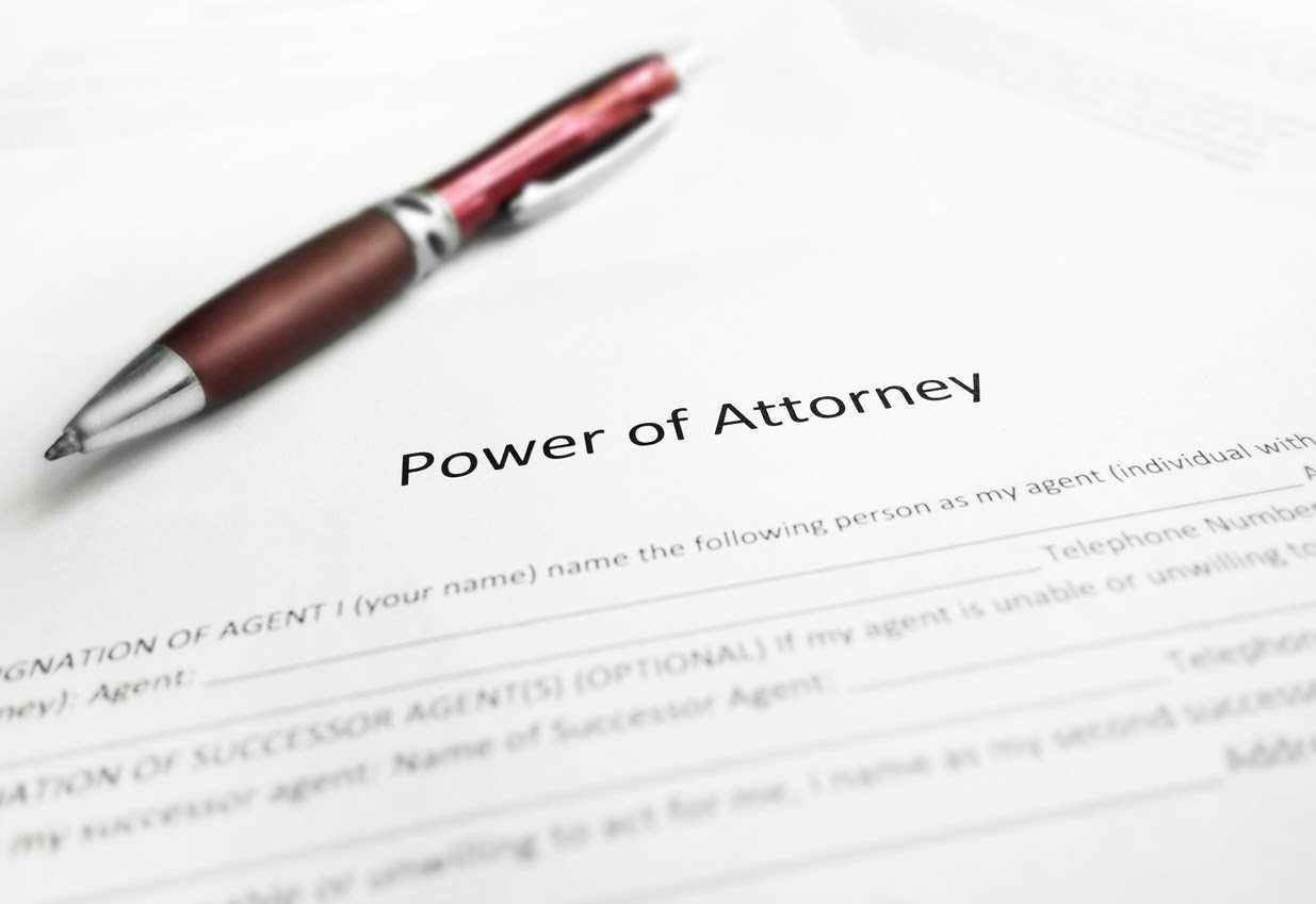 Close-up shot of a Power of Attorney legal document with pen enacted with Form 2848.