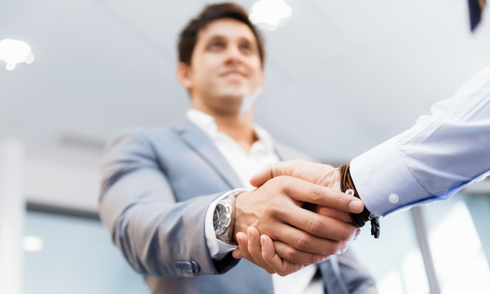 Shaking Hands With Accountant After Creating Foreign Bank Account