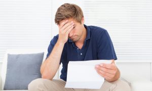 man in debt applying for irs partial payment installment agreement plan