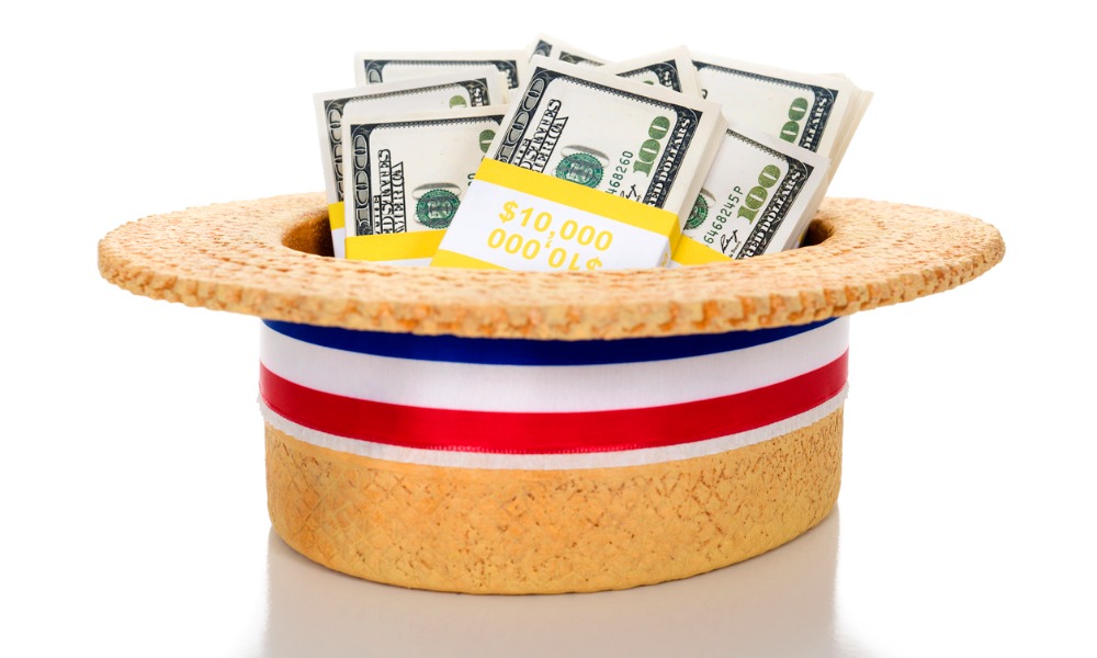 A hat holds many cash political contributions, illustrating our guide to whether political contributions are tax deductible.