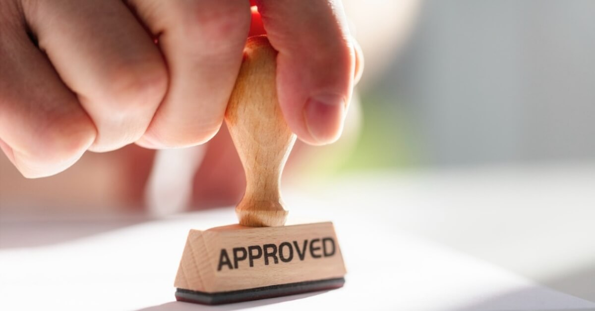 A stamp of approval on a sheet of paper representing an IRS first-time penalty abatement