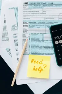 IRS Form 1040 with a "Need help?" sticky note.