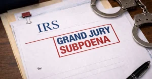 Grand jury subpoena on wooden surface